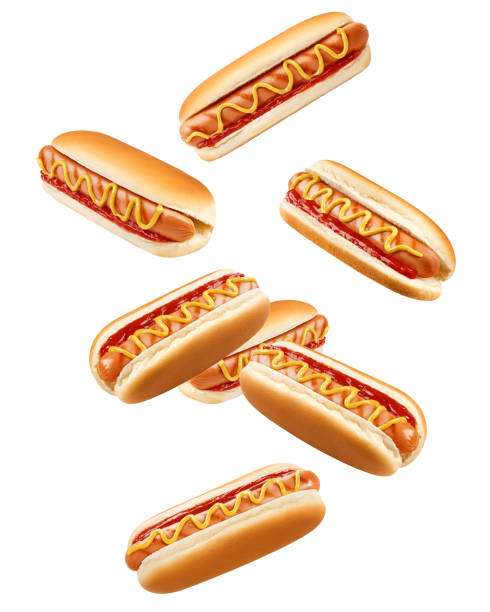 Falling HOT DOG isolated on white background, clipping path, full depth of field Falling HOT DOG isolated on white background, clipping path, full depth of field fast food restaurant photos stock pictures, royalty-free photos & images
