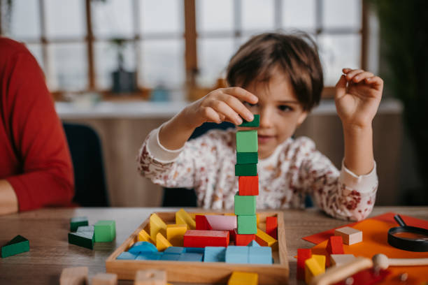 istock Girl playing with toys 1354875811