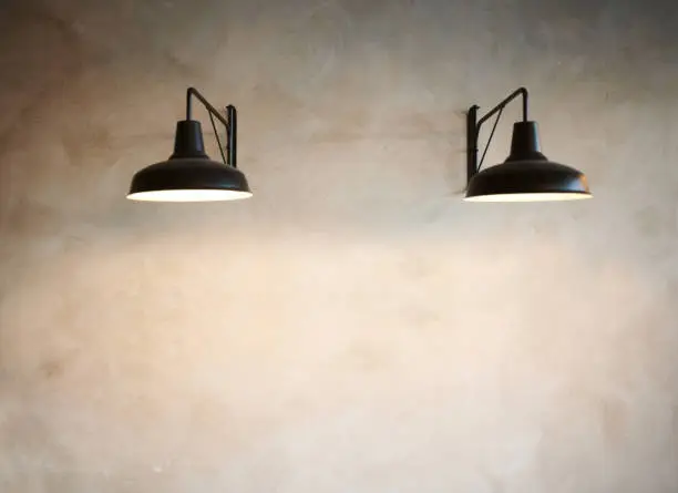Photo of Shot of an empty wall with a light fixture