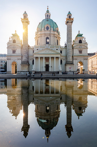 Karlskirche church reflected in pond, Vienna, Austria