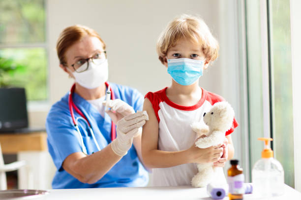 istock Child covid-19 vaccine. Coronavirus vaccination. 1354876274