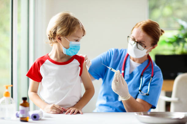 istock Child covid-19 vaccine. Coronavirus vaccination. 1354876570