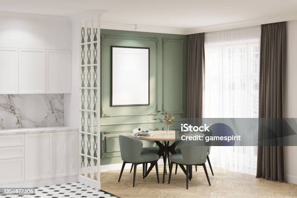 Modern Classic Dining Room With A Blank Vertical Poster On The Green Classic Wall Round Table With Chairs Near A Large Window With Curtains White Kitchen With Classic Decorative Partition Stock Photo - Download Image Now