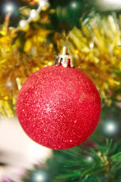 istock Round shiny toy balls on a Christmas tree 1354877353