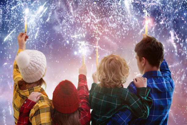 happy new year. family watching fireworks. - new year people family offspring imagens e fotografias de stock