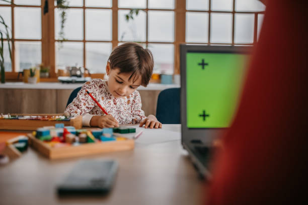 istock Little girl drawing 1354879669