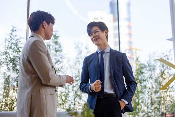 istock Two Asian business men are shaking hands 1354879851