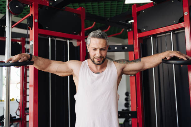 istock Young man during his workout in the gym 1354879913