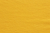 istock Yellow cotton fabric texture background, seamless pattern of natural textile. 1354884396