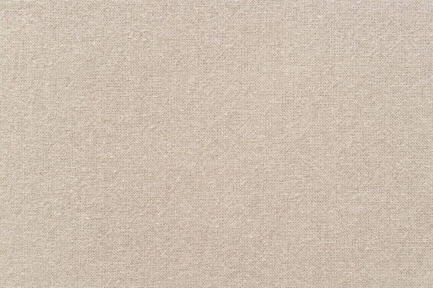 istock Brown cotton fabric texture background, seamless pattern of natural textile. 1354884432