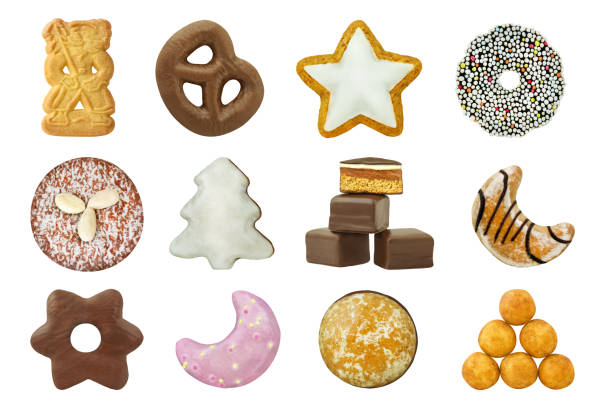 Various Christmas cakes and sweets isolated against white background