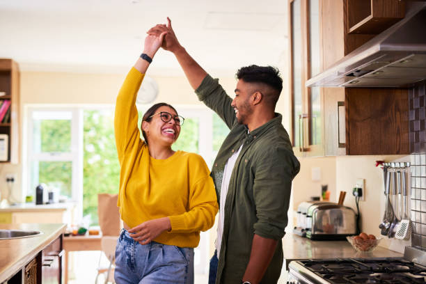 Shot of a young couple dancing together in their kitchen I could dance with you forever married stock pictures, royalty-free photos & images