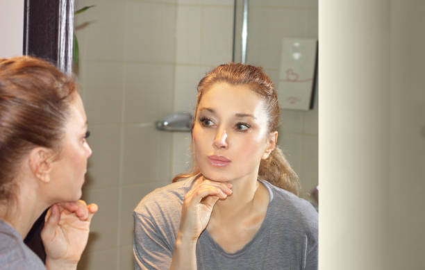 istock Applying the cream..Magic anti-aging cream. 1354886367