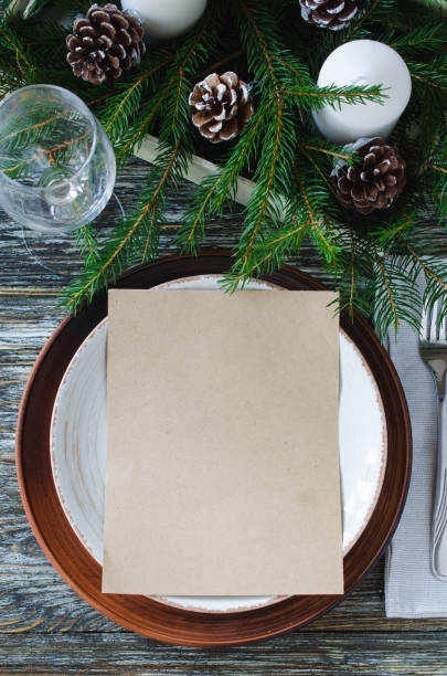 istock Christmas table setting with candles and fir branches 1354888785