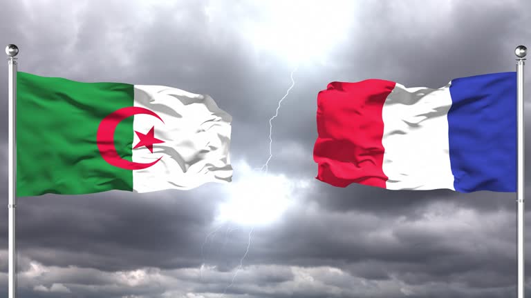 Algeria And France Flags Waving Against Each Other | Loopable.
