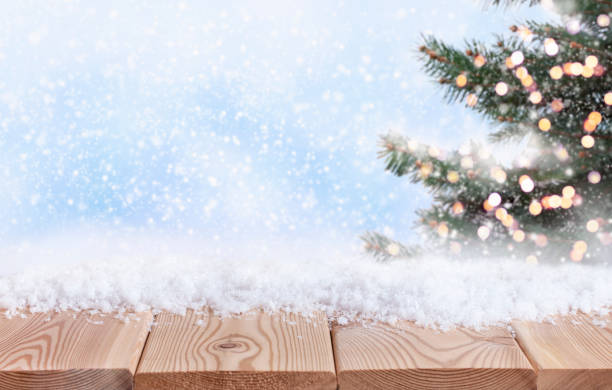 istock Christmas background with pine and wooden table top 1354891040