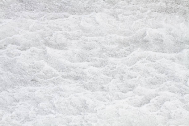 istock rough surface of white snow 1354891082