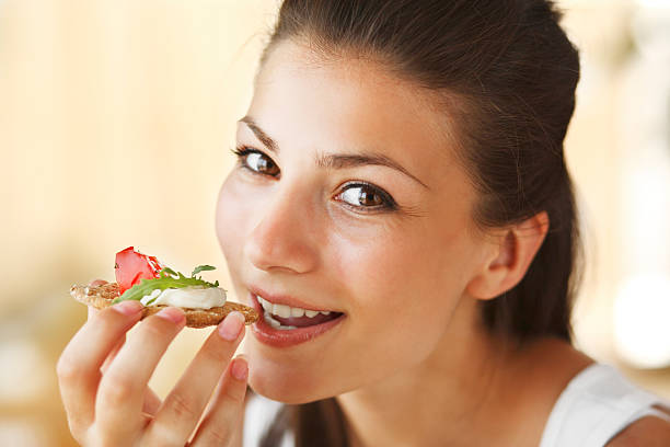 istock Happy woman eating sandwich 135489301