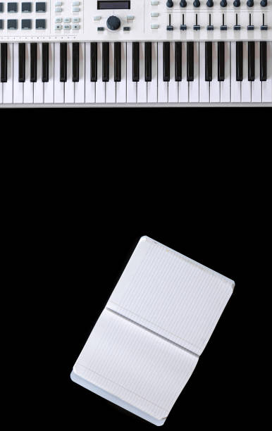 istock Music keys and notepad on black background, top view, flat lay. 1354895030