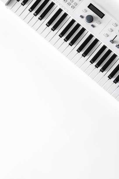 istock Musical background with musical keys on white, flat lay, copy space. 1354895191