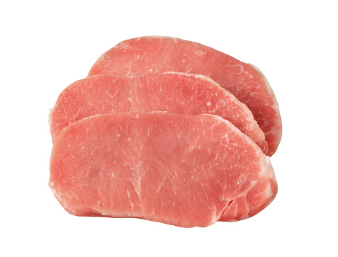 Three raw pork steaks isolated