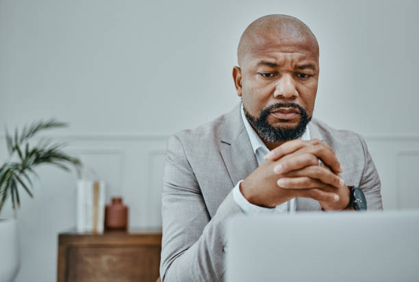 istock Shot of a mature businessman using a laptop in a modern office 1354898607