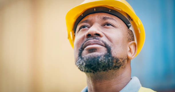 Shot of a mature man wearing a hardhat at work