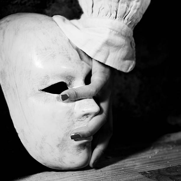 istock Fingers covering a white mask 135490040