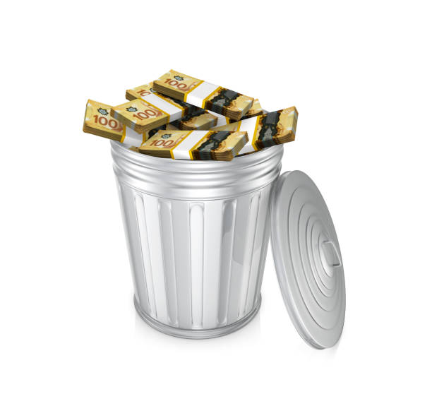 istock Canadian Dollar money garbage trash 1354903495