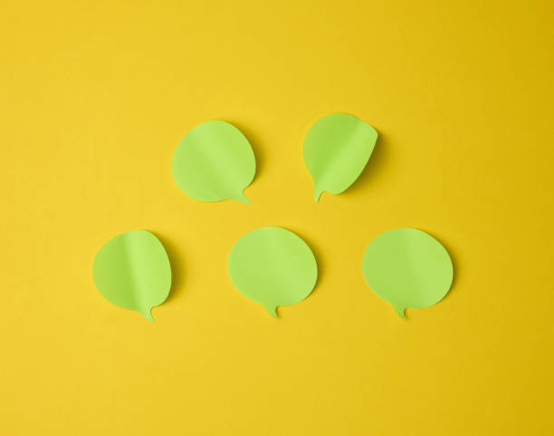 istock cloud shaped blank paper green stickers on yellow background 1354903691