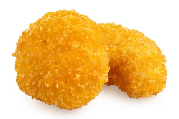 Two fried gluten free cornflake crumb chicken nuggets isolated on white.