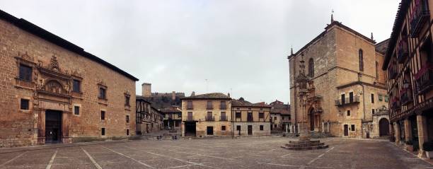 Main Square of Peñaranda de Duero, Burgos, Spain. Palace of the Counts of Miranda, Catholic church of Santa Ana and Pillory. medieval restraints stock pictures, royalty-free photos & images