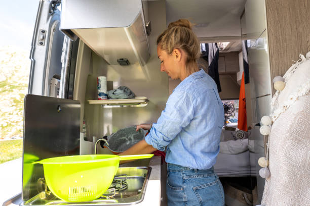 istock Woman doing the dishes in her van 1354908514
