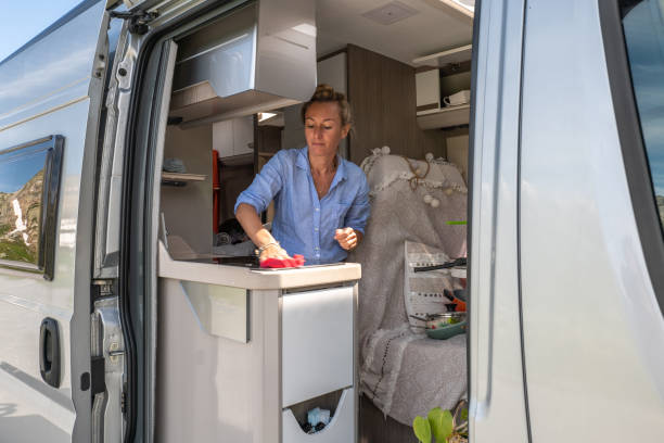 istock Woman doing the dishes in her van 1354908671