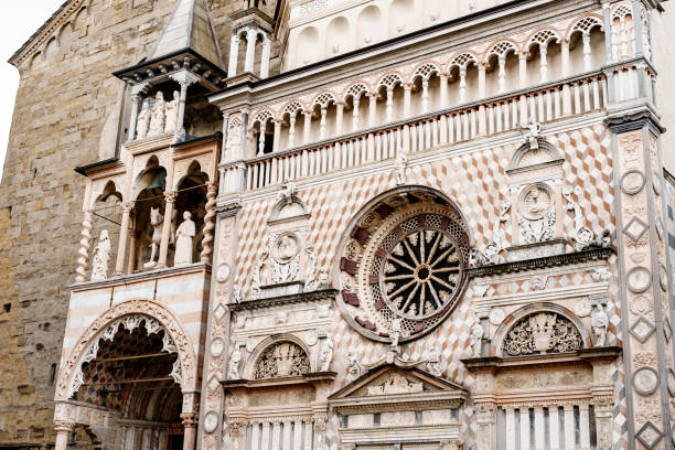 statues, columns and stucco moldings on the facade of the colleoni chapel. bergamo, italy - moulding architecture and buildings monument column imagens e fotografias de stock