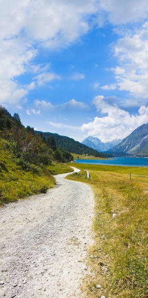 istock Country road around Sils Lake on upper Engadine Valley (Switzerland - Europe) - image with copy space 1354909901