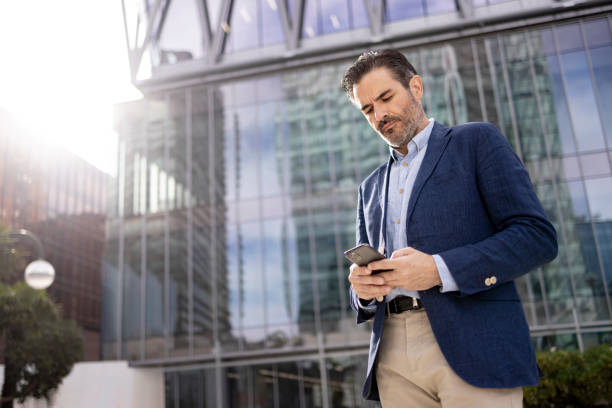 istock Successful businessman of Hispanic ethnicity using a smart phone 1354911520