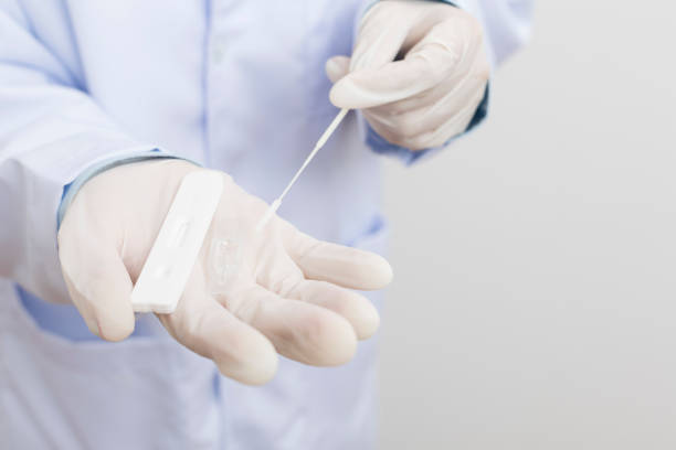 istock Medical personnel holding Antigen Test Kit (ATK) 1354914196