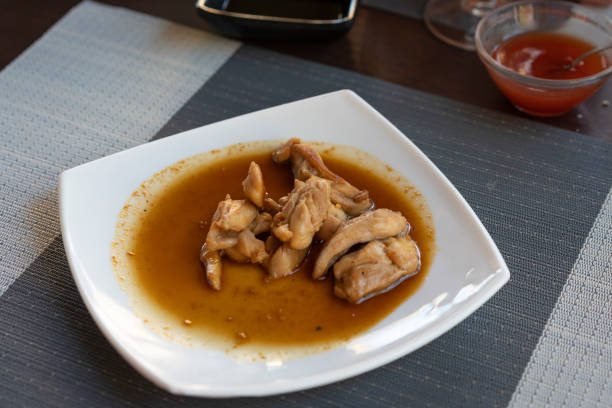 Asian dish with chicken and Teriyaki sauce at the restaurant