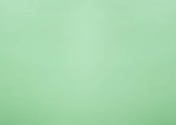 istock Green paper cardboard and wall texture for background. Gradient grunge background top view. Textured surface template for banner, poster. Abstract pattern. Raster image 1354914933