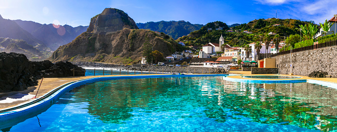 Scenic Madeira island, natural swimming pools of charming Porto da Cruz village. Popular tourist resort in Portugal