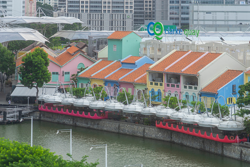 Singapore, Singapore - 2021: Colourful shophouses and waterfront dining areas around the Clarke Quay district, largely empty due to the restrictions on operating during the COVID-19 pandemic. (Exact photography date unknown due to incorrect camera date settings)