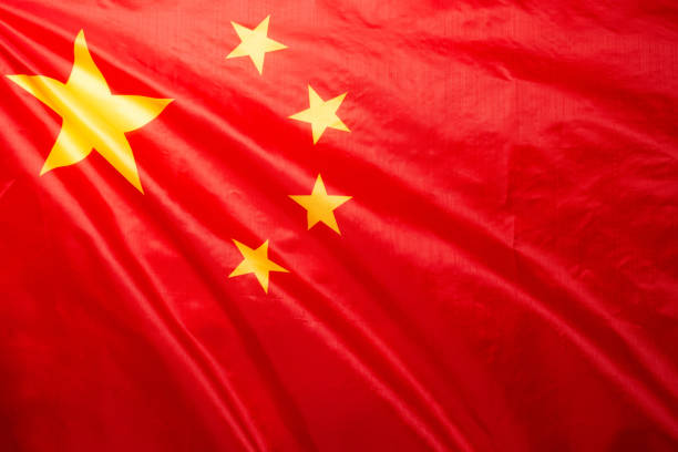 istock China flag waving as a background. 1354916762