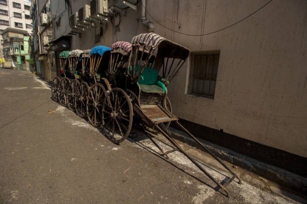 istock Few famous hand pulled rickshaw parked road side on streets of Kolkata 1354917573