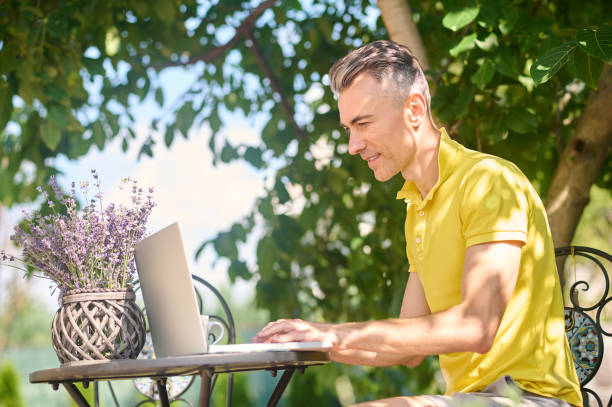istock A man working on a laptop and looking busy 1354917864