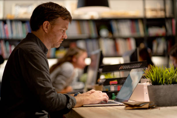 istock Caucasian business manager work with serious and concentrate using laptop with his team 1354918866