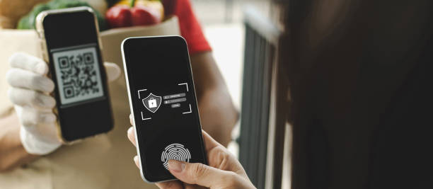 istock Login. customer hand using digital mobile phone scan QR code paying for buy fresh food set bag from food delivery service man, express delivery, digital payment technology, fast food delivery concept 1354919343