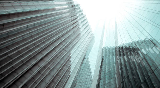 istock Architecture background with glass skyscrapers, looking up 1354920295