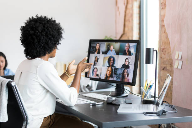 istock Unrecognizable business professional gestures while leading meeting 1354923983
