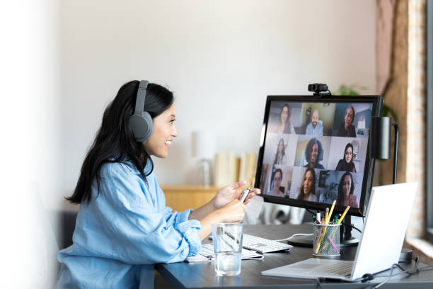 istock Woman enjoys meeting virtually with co-workers 1354924002